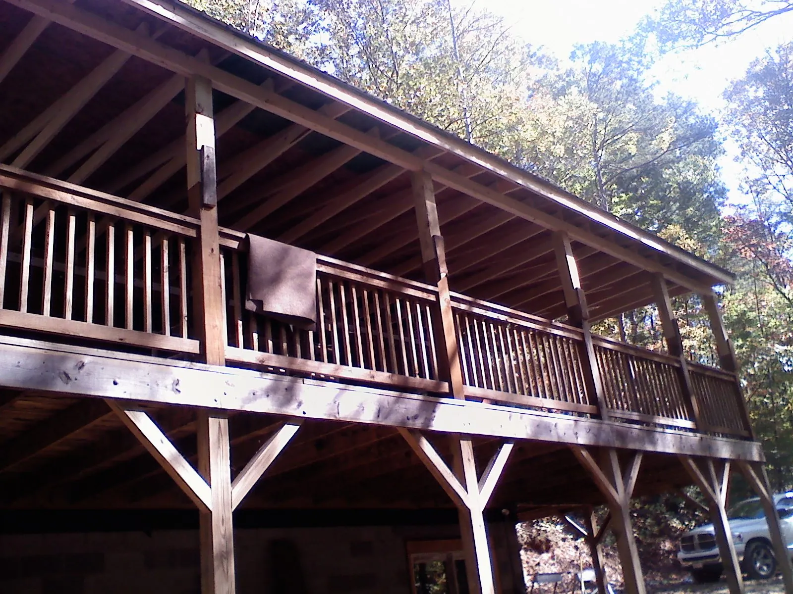 Timber framing under a new elevated porch and deck — Roof Leak Repair in Mc Kenney by Roofing Brothers